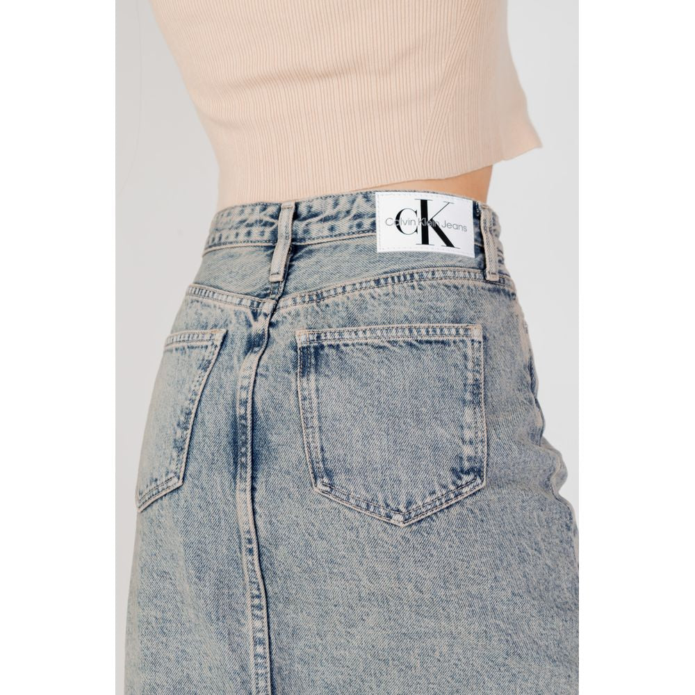 Skirt by Calvin Klein Jeans for women in cotton blue showcases a dramatic silhouette, artfully capturing the essence of the Women's Cotton Skirt in a dramatic cut for a refined look.