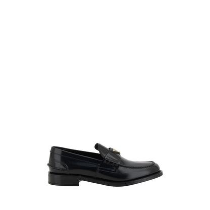 Loafers Flat Shoes by Prada for women in leather black & signature showcases a sculptural silhouette as part of the Grace Women's Leather Loafers Flat Shoes collection, defined by a sculptural round toe style and for a sculptural look.