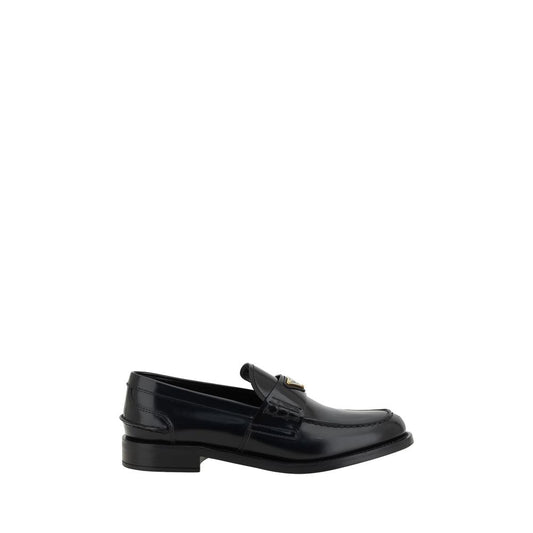 Loafers Flat Shoes by Prada for women in leather black & signature showcases a sculptural silhouette as part of the Grace Women's Leather Loafers Flat Shoes collection, defined by a sculptural round toe style and for a sculptural look.