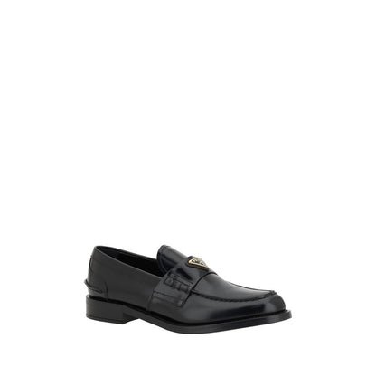 Loafers Flat Shoes by Prada for women in leather black & signature features an statuesque silhouette from the Grace Women's Leather Loafers Flat Shoes collection, showcasing a and a statuesque round toe style for a statuesque look.