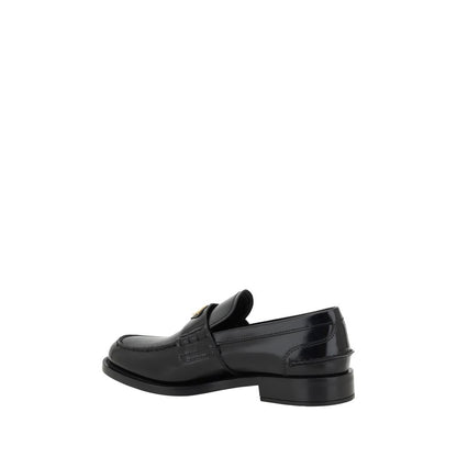 Loafers Flat Shoes by Prada for women in leather black & signature features an stately silhouette, showcasing the stately style of the Grace Women's Leather Loafers Flat Shoes with its distinct and refined round toe style.