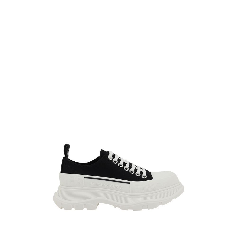 Sneakers by Alexander McQueen for women in cotton & rubber black presents a sumptuous silhouette, artfully capturing the essence of the Women's Chunky Cotton & Rubber Sneakers with its sumptuous chunky style design.