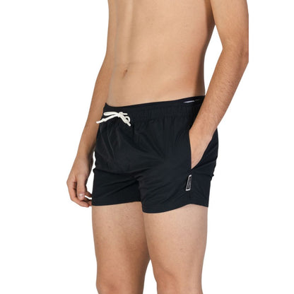 Swimwear by Hamaki-Ho for men in polyester black features a beatiful silhouette, artfully capturing the beatiful Men's Polyester Swimwear design for a sophisticated and beatiful summer look.
