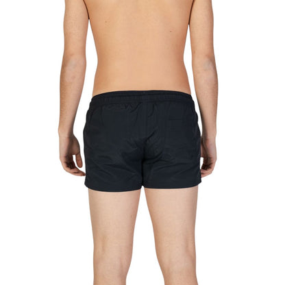 Swimwear by Hamaki-Ho for men in polyester black features an beach ready silhouette, showcasing the beach ready design of the Men's Polyester Swimwear for a sophisticated poolside look.