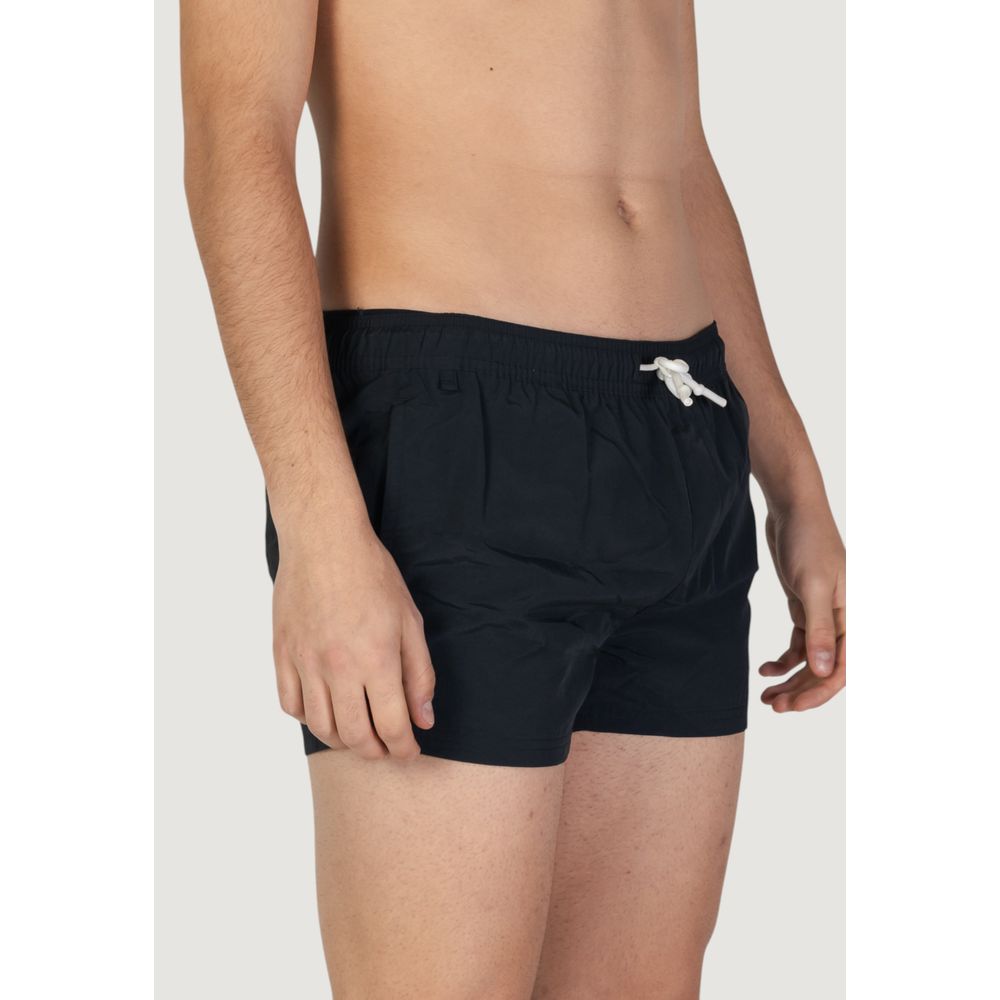 This Swimwear by Hamaki-Ho for men in polyester black showcases a eye catching silhouette from the Men's Polyester Swimwear collection, featuring a eye catching cut designed for poolside elegance.