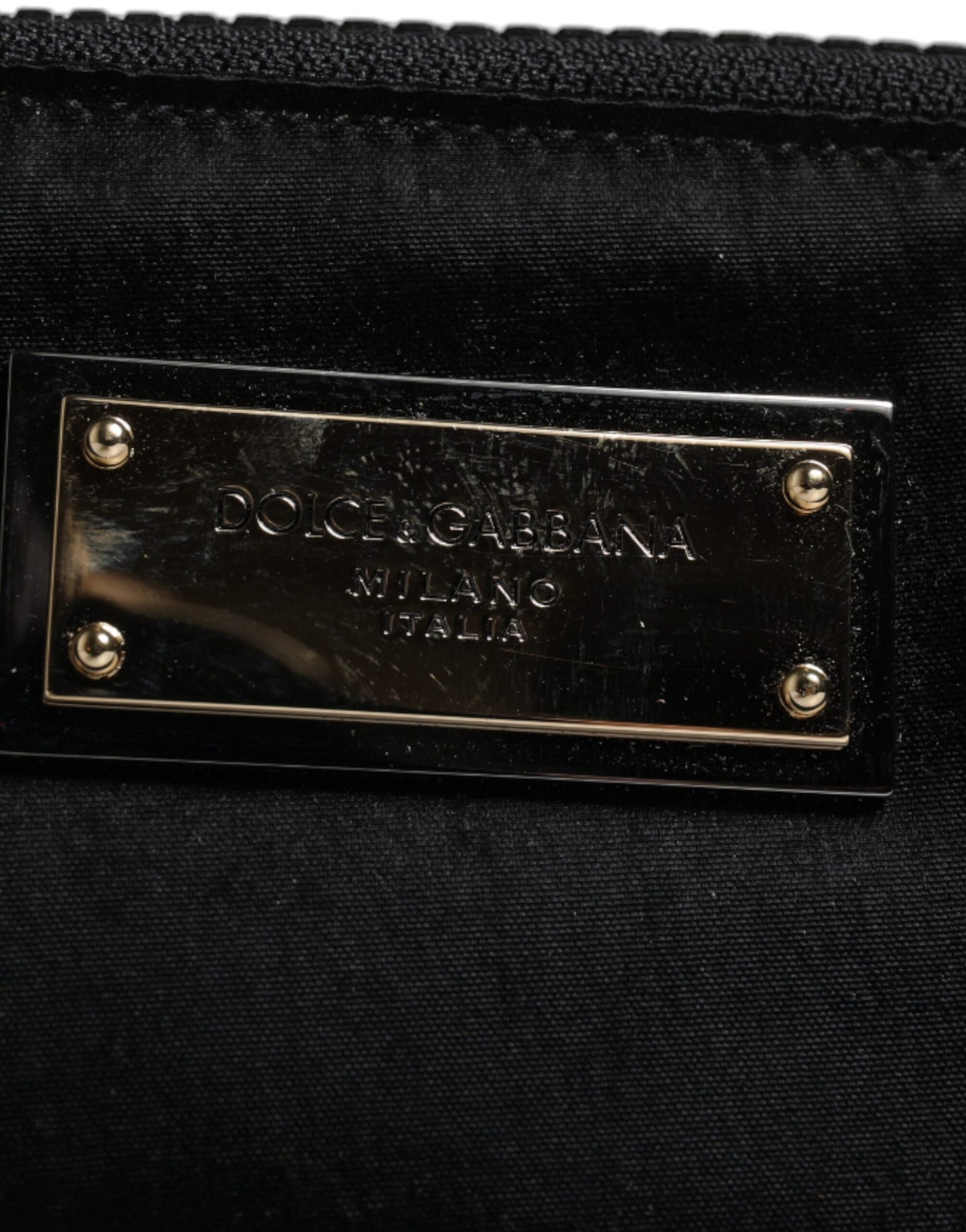 Pouch Clutch Handbag by Dolce & Gabbana for men in calfskin leather & nylon black, gold & silver showcases a sculptural silhouette, featuring a secure zipper, ample , and versatile for a sculptural finish.