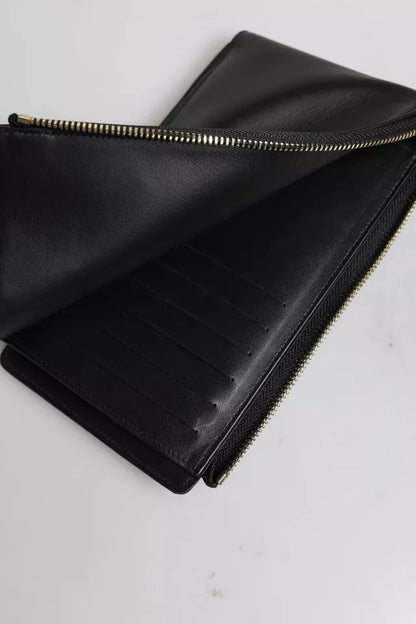 Cardholder Wallet by Dolce & Gabbana for women in leather black showcases a refined silhouette, artfully detailed with the signature style of the Leather Cardholder Wallet and functional card-organization coin-purse.