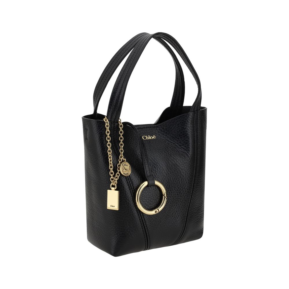 Shoulder Bag by Chloé for women in grained horse leather black & monogram presents a versatile silhouette, showcasing a secure magnetic & button and versatile single-compartment with versatile shoulder-strap, handle & adjustable-strap for a sophisticated look.