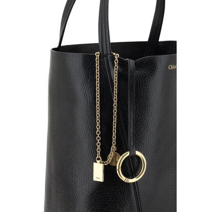Shoulder Bag by Chloé for women in grained leather black & monogram features a distinguished silhouette, showcasing a secure and distinguished single-compartment with versatile shoulder-strap & handle for a distinguished finish.