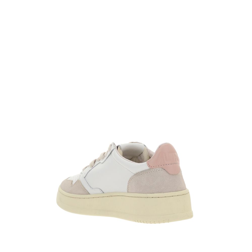 Sneakers by Autry for women in bos taurus calfskin leather & nylon white presents a sumptuous silhouette, artfully capturing the essence of the Women's Low Top Bos Taurus Calfskin Leather & Nylon Sneakers with its sumptuous low-top style design.