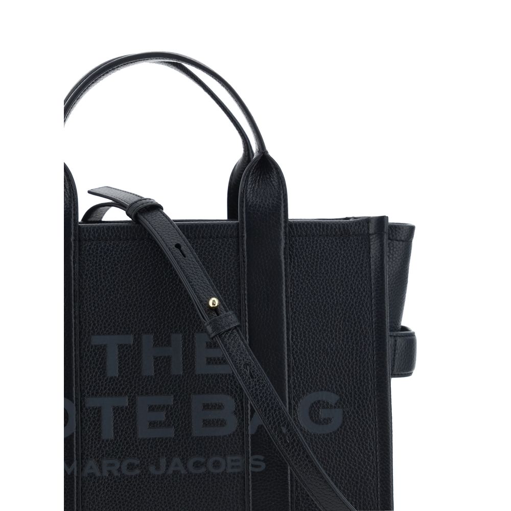 Medium Tote Handbag by Marc Jacobs for women in bos taurus calf grained leather black & monogram features a contemporary silhouette, showcasing a secure zipper, ample , and contemporary shoulder-strap, handle & adjustable-strap for a sophisticated look.