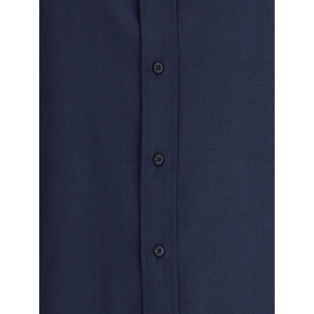 Dress Shirt by Brunello Cucinelli for men in cotton blue showcases a sharp silhouette, elegantly detailed with a sharp and sharp .