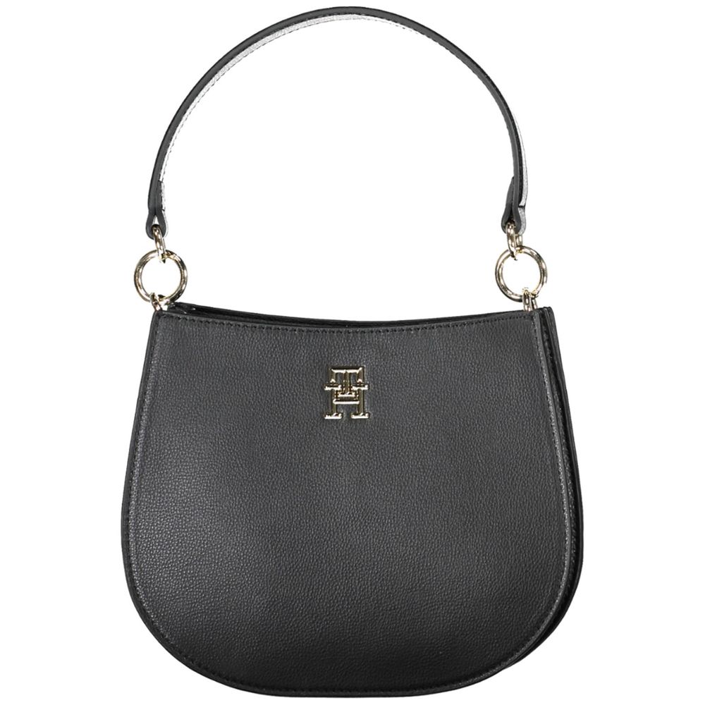 Crossbody Evening Convertible Handbag by Tommy Hilfiger for women in polyester polyethylene faux leather black features an exquisite silhouette, showcasing a secure zipper, ample built-in-compartments, and exquisite crossbody-strap, shoulder-strap, adjustable-strap & handle for a sophisticated finish.