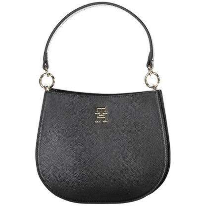 Crossbody Evening Convertible Handbag by Tommy Hilfiger for women in polyester polyethylene faux leather black features an exquisite silhouette, showcasing a secure zipper, ample built-in-compartments, and exquisite crossbody-strap, shoulder-strap, adjustable-strap & handle for a sophisticated finish.