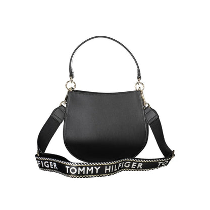 Crossbody Evening Convertible Handbag by Tommy Hilfiger for women in polyester polyethylene faux leather black features a exquisite silhouette with a secure zipper, ample built-in-compartments, and versatile crossbody-strap, shoulder-strap, adjustable-strap & handle for a exquisite look.