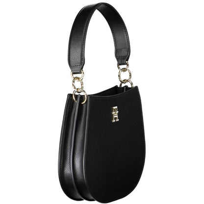 Crossbody Evening Convertible Handbag by Tommy Hilfiger for women in polyester polyethylene faux leather black features a polished silhouette with a secure zipper, ample built-in-compartments, and polished crossbody-strap, shoulder-strap, adjustable-strap & handle for a sophisticated look.