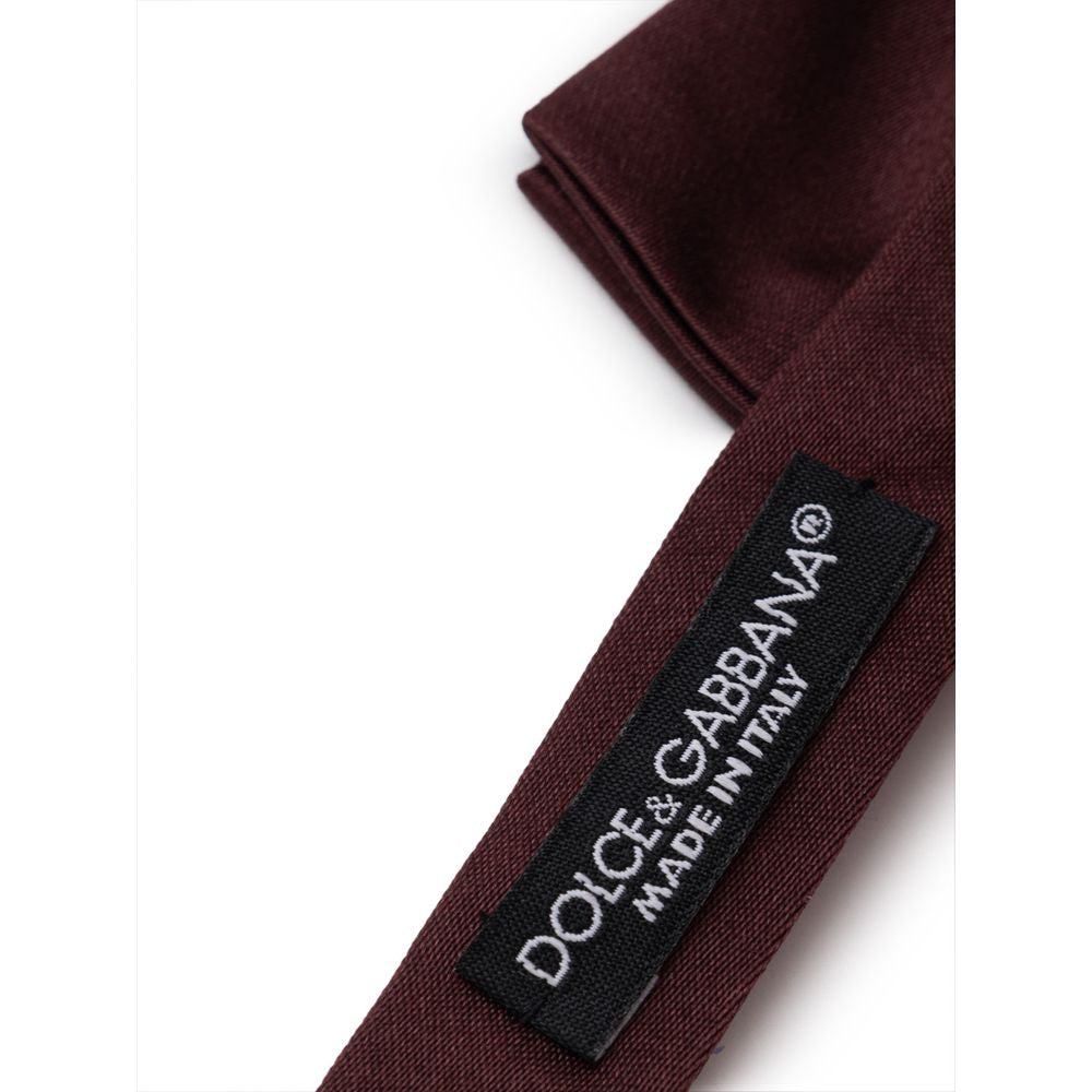 Necktie by Dolce & Gabbana for men in silk burgundy features an effortlessly chic silhouette, showcasing a sophisticated effortlessly chic finish from the signature Silk Necktie collection.