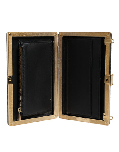 Evening Crossbody Clutch Handbag by Dolce & Gabbana for women in leather & brass black & gold showcases a sculptural silhouette, featuring a secure , ample cardholder, and versatile crossbody-strap for a sculptural aesthetic.