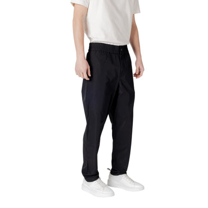 Hooded Pants by Calvin Klein Jeans for men in polyester black features a stylish silhouette with a stylish relaxed-fit & regular-fit, long, and .