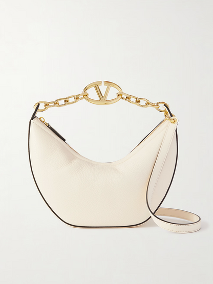 Small 2-in-1 Shoulder & Crossbody Hobo Convertible Handbag by Valentino Garavani for women in calfskin leather black, ivory & signature features a polished silhouette with a secure , ample , and polished crossbody-strap & shoulder-strap for a sophisticated look.