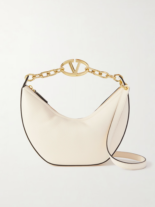 Small 2-in-1 Shoulder & Crossbody Hobo Convertible Handbag by Valentino Garavani for women in calfskin leather black, ivory & signature features a polished silhouette with a secure , ample , and polished crossbody-strap & shoulder-strap for a sophisticated look.
