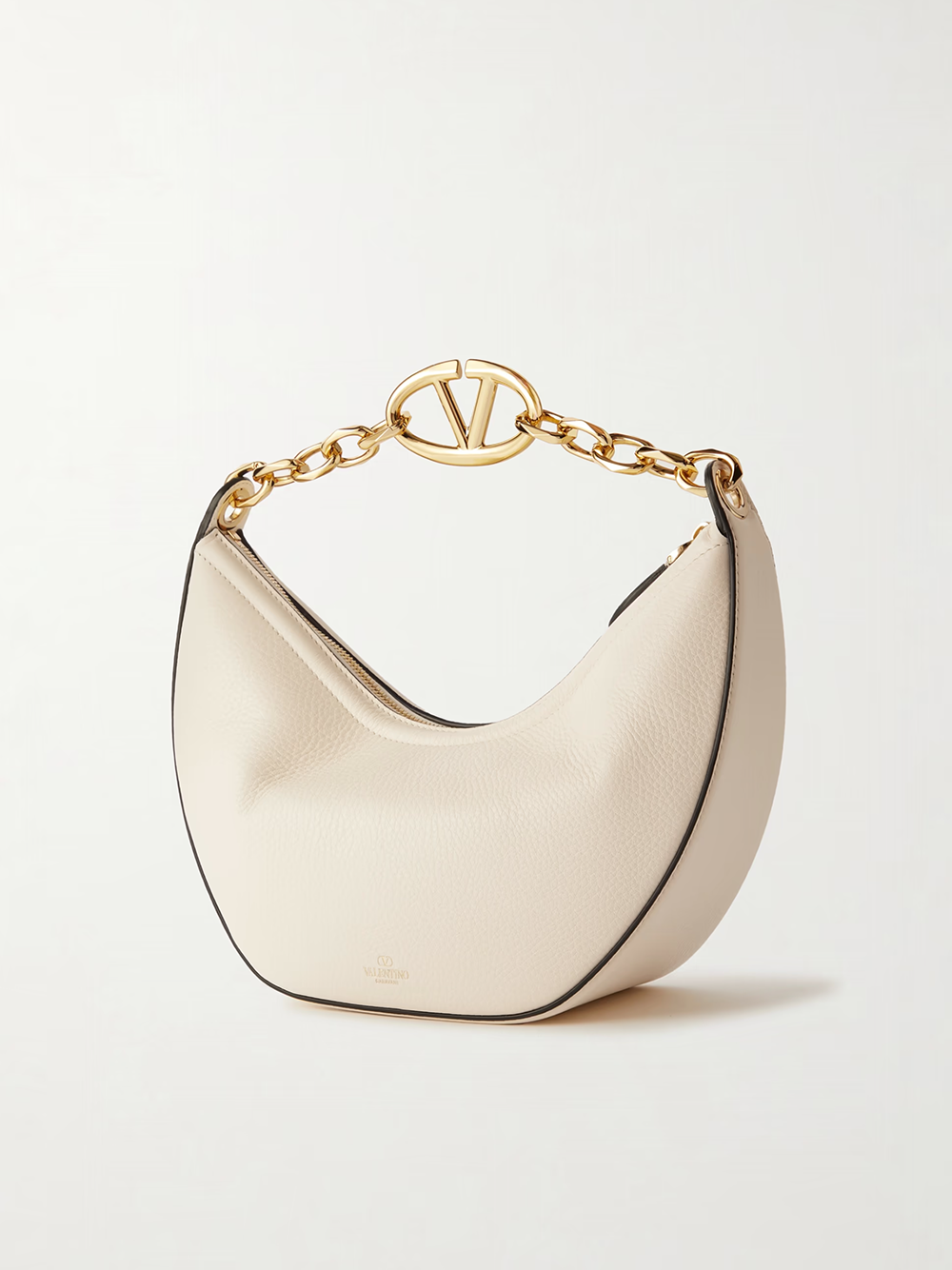 Small 2-in-1 Shoulder & Crossbody Hobo Convertible Handbag by Valentino Garavani for women in calfskin leather black, ivory & signature presents a enviable design with a secure , ample , and versatile crossbody-strap & shoulder-strap for a sophisticated look.