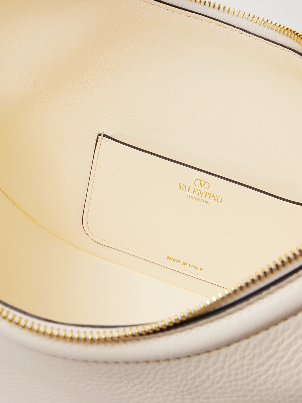 Small 2-in-1 Shoulder & Crossbody Hobo Convertible Handbag by Valentino Garavani for women in calfskin leather black, ivory & signature features an exquisite silhouette, showcasing a secure , ample , and exquisite crossbody-strap & shoulder-strap for a sophisticated finish.