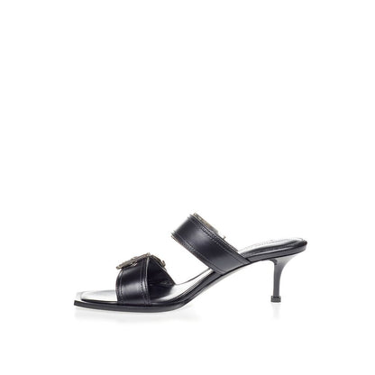Sandals by Alexander McQueen for women in leather black showcases a sculptural silhouette as Women's Leather Sandals, defined by a sculptural and sculptural for a sculptural look.