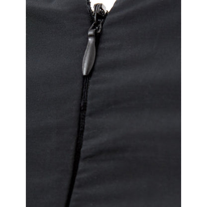 Dress by Lardini for women in polyester black presents a sinuous silhouette, showcasing a sophisticated v-neck neckline and detailed with a sinuous for a refined finish.