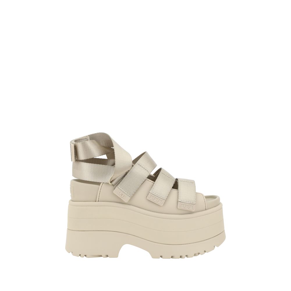 Platform Sandals by UGG for women in rubber beige features an statuesque silhouette from the Women's Rubber Platform Sandals collection, showcasing a statuesque platform and elegant round toe style.
