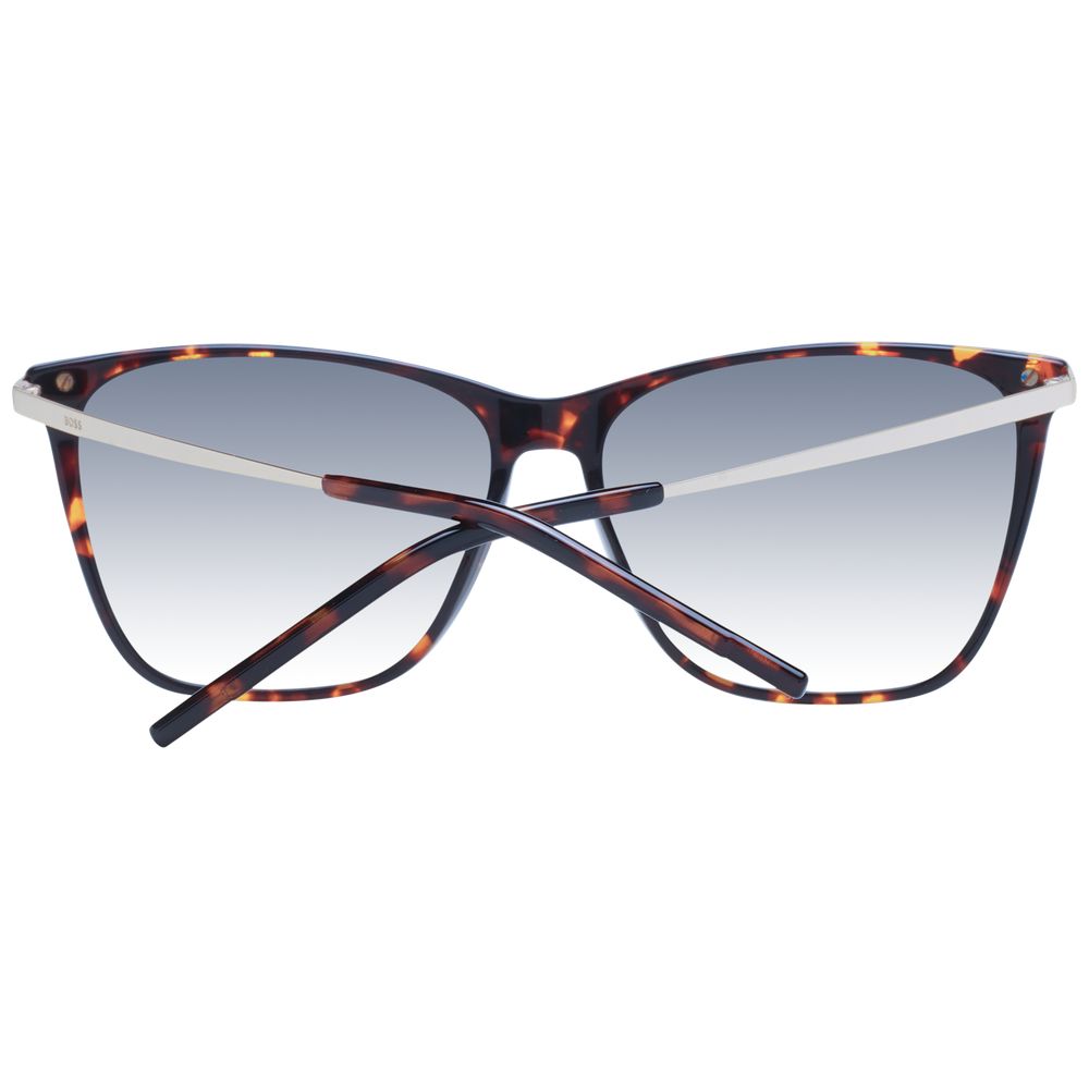 This Sunglasses by Hugo Boss for women in acetate brown presents a sumptuous silhouette, showcasing a sumptuous full-rim cat-eye frame design in brown coloured frame and high-performance gradient category-2-medium-tint lens.