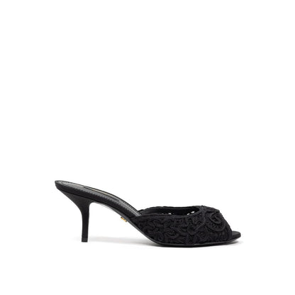 Sandals by Dolce & Gabbana for women in cotton and black presents a captivating silhouette, showcasing the signature style of the Women's Cotton Sandals with a captivating and captivating .