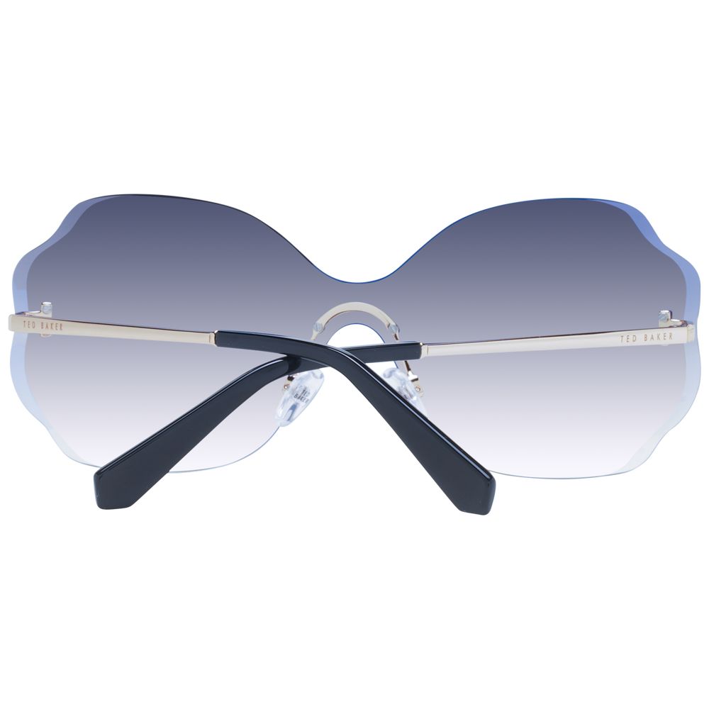 Sunglasses by Ted Baker for women in and gold presents a sumptuous silhouette, featuring gold coloured frame and rimless mono-lens frame design with gradient category-3-dark-tint lens for a sumptuous look.