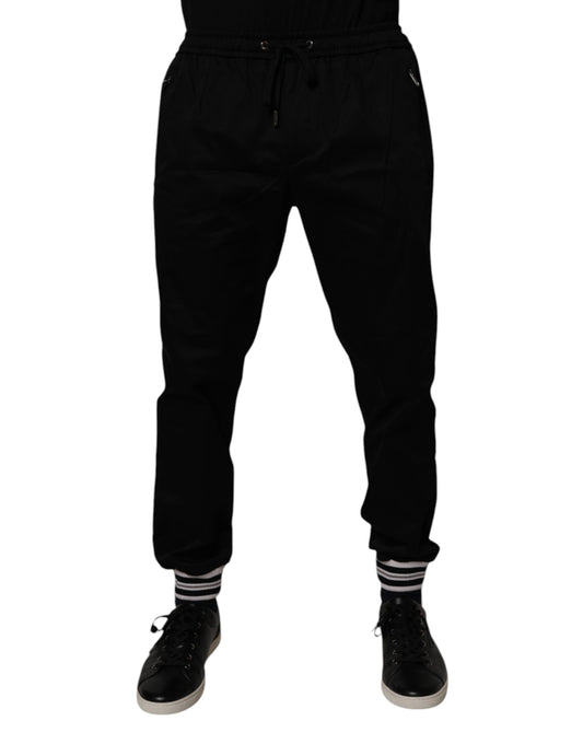Jogger Sweatpants by Dolce & Gabbana for men in stretch cotton black features a contemporary silhouette with , a contemporary , long hem, and for a premium, high-performance aesthetic.