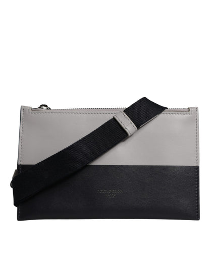 Crossbody Backpack by Dolce & Gabbana for men in calfskin leather & nylon black & white showcases a stately Calfskin Leather Nylon Crossbody Backpack design, featuring a secure zipper with stately and versatile crossbody-strap.