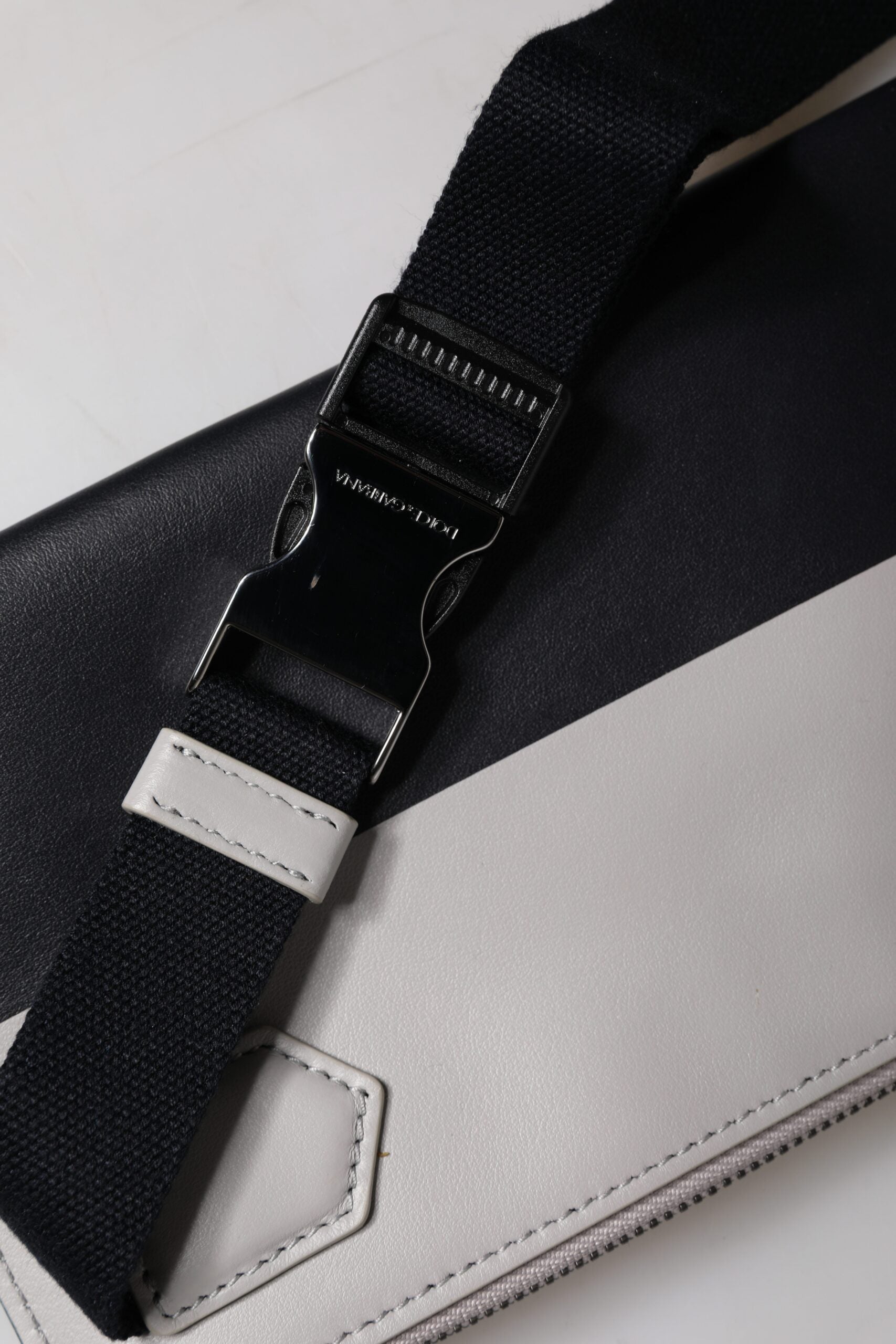 Crossbody Backpack by Dolce & Gabbana for men in calfskin leather & nylon black & white features an stately silhouette from the Calfskin Leather Nylon Crossbody Backpack range, with a secure zipper, ample , and versatile crossbody-strap.