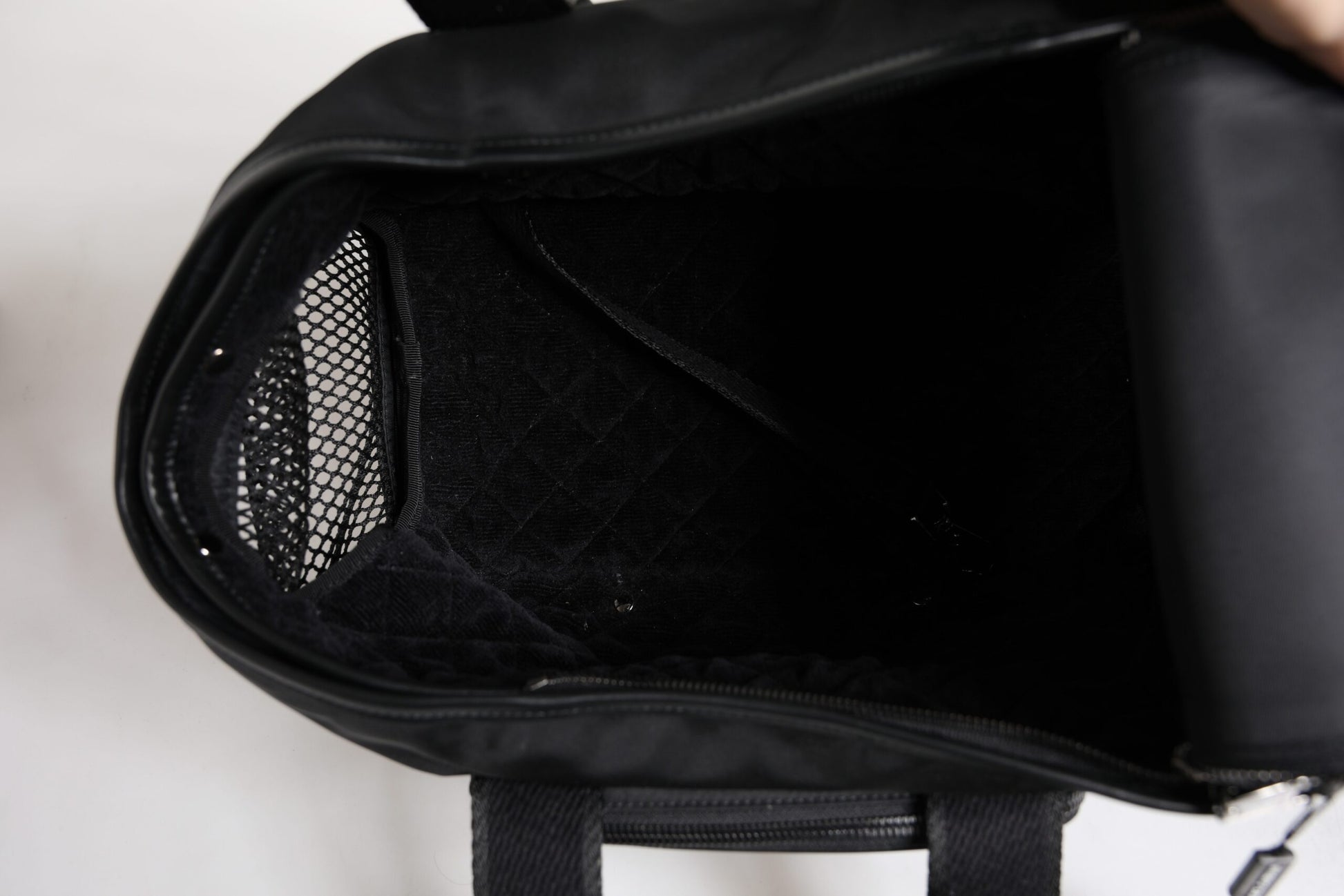 Pet Carry Backpack by Dolce & Gabbana for men in leather & nylon black & silver showcases a stately Leather Nylon Pet Carry Backpack design, featuring a secure zipper with stately and versatile shoulder-strap, handle, adjustable-strap & detachable-strap.