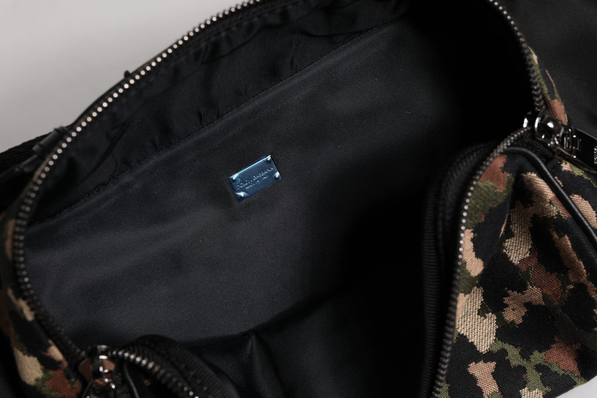 Fanny Pack Backpack by Dolce & Gabbana for men in leather & poly cotton black, gold & multicolor features a refined silhouette, showcasing the Leather Poly Cotton Fanny Pack Backpack design with a secure zipper, ample , and versatile adjustable-strap & belt-strap.