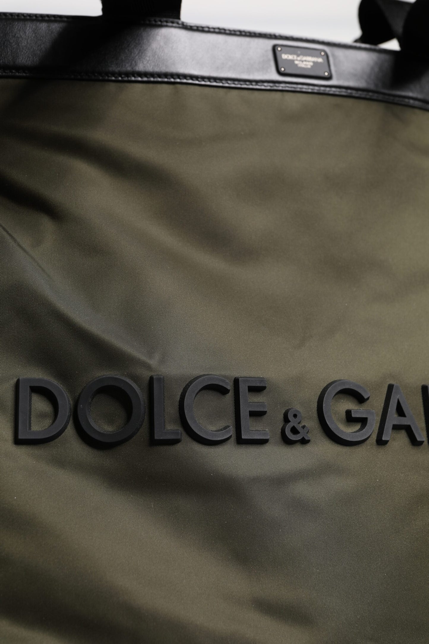 Tote Bag by Dolce & Gabbana for men in calf leather & nylon military-green features an jet-set-ready silhouette, showcasing the Calf Leather Nylon Tote Bag design with a secure , ample , and versatile shoulder-strap & handle.