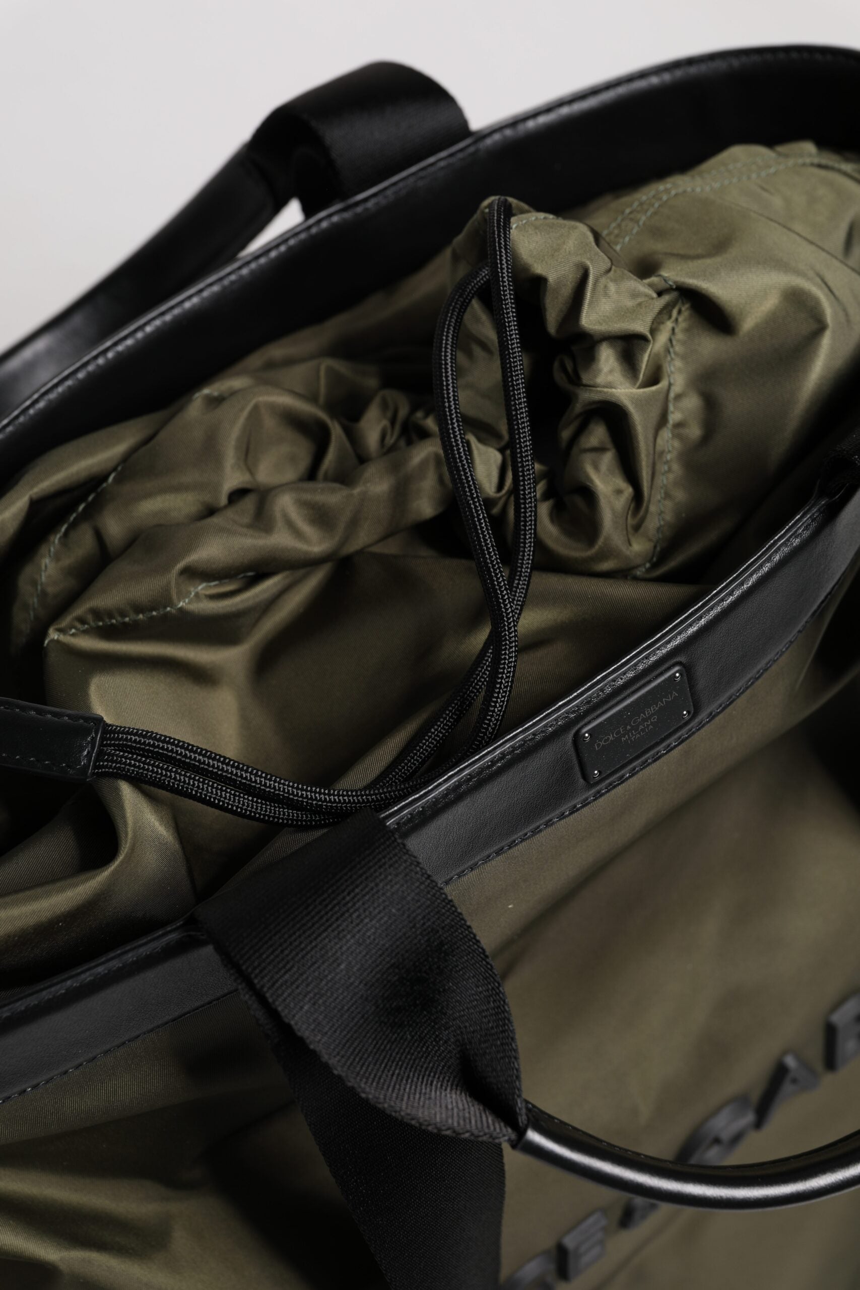 Tote Bag by Dolce & Gabbana for men in calf leather & nylon military-green features an jet-setting Calf Leather Nylon Tote Bag design with a secure , jet-setting , and versatile shoulder-strap & handle for a jet-setting look.