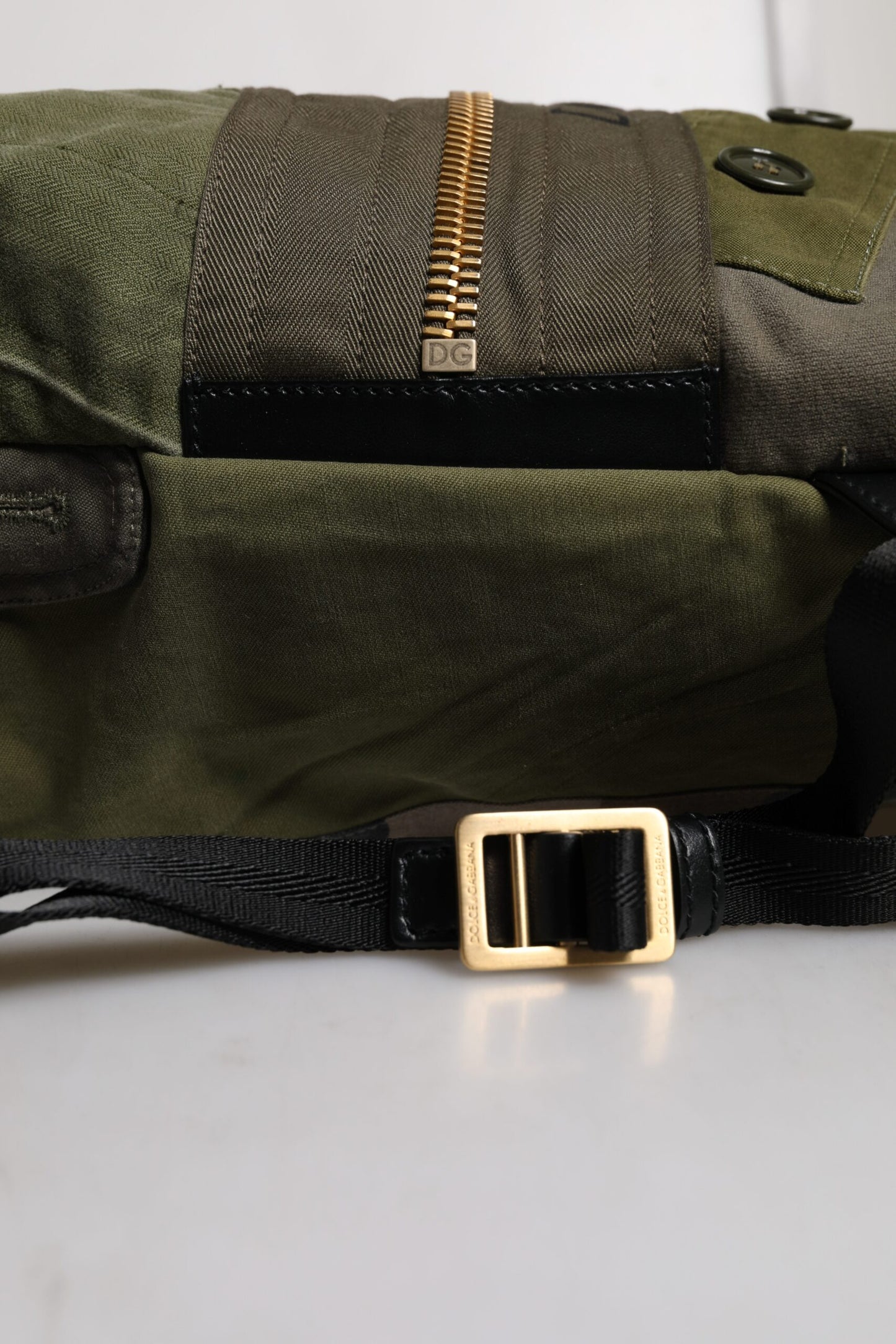 Large Drawstring Rucksack Backpack by Dolce & Gabbana for men in calf leather & cotton military-green, camouflage & patchwork features a stately Calf Leather Cotton Large Drawstring Rucksack Backpack design, showcasing a secure drawstring, ample internal-pockets, and versatile backpack-strap for a stately finish.