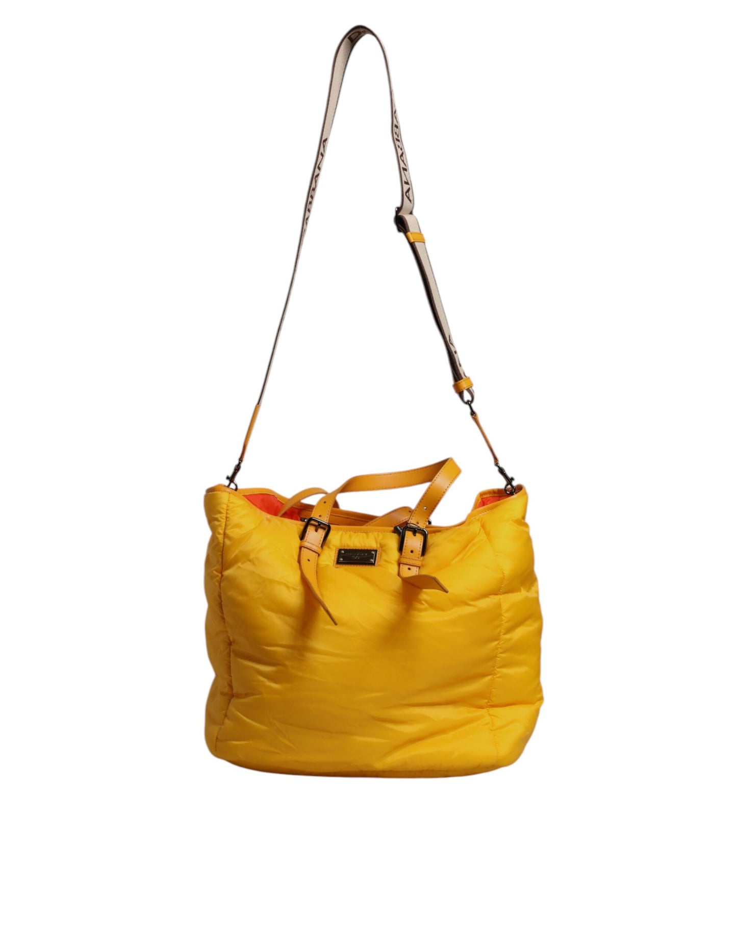 This Tote Bag by Dolce & Gabbana for men in pu leather orange & yellow features an jet-set PU Leather Tote Bag design with a secure zipper, ample internal-pockets, and jet-set shoulder-strap, handle, adjustable-strap & detachable-strap.