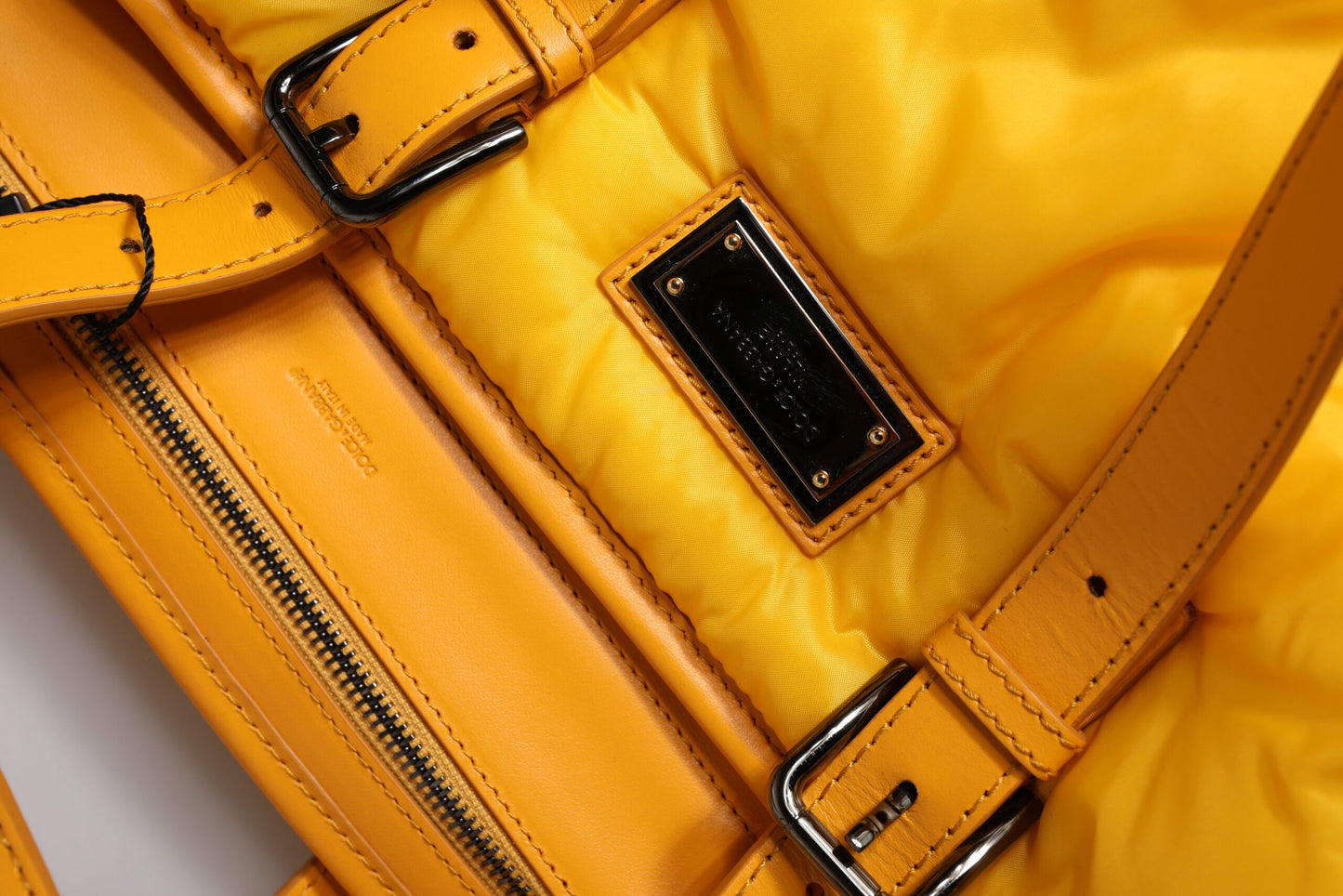 Tote Bag by Dolce & Gabbana for men in pu leather orange & yellow features a jet-set PU Leather Tote Bag design, complete with a secure zipper, ample internal-pockets, and versatile shoulder-strap, handle, adjustable-strap & detachable-strap for a jet-set look.