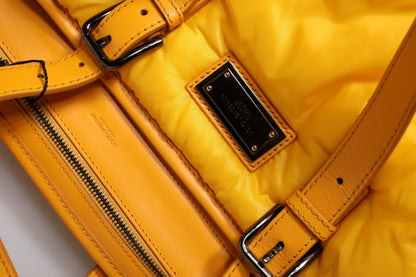 Tote Bag by Dolce & Gabbana for men in pu leather orange & yellow features a jet-set PU Leather Tote Bag design, complete with a secure zipper, ample internal-pockets, and versatile shoulder-strap, handle, adjustable-strap & detachable-strap for a jet-set look.