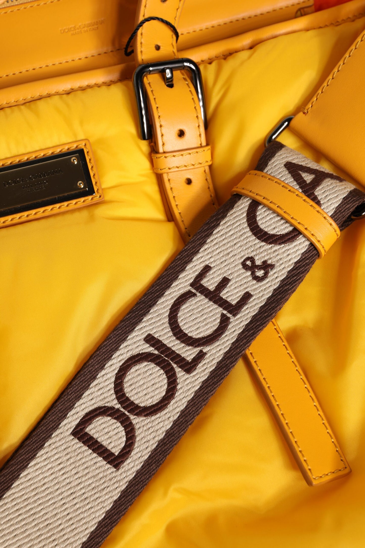 Tote Bag by Dolce & Gabbana for men in pu leather orange & yellow features an jet-set-ready silhouette, showcasing the PU Leather Tote Bag design with a secure zipper, ample internal-pockets, and versatile shoulder-strap, handle, adjustable-strap & detachable-strap.