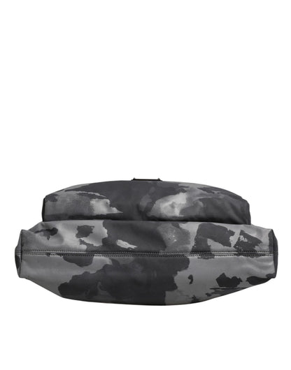 This Tote Bag by Dolce & Gabbana for men in poly cotton & leather gray, patterned & camouflage features an jet-set Poly Cotton Leather Tote Bag design with a secure zipper, ample built-in-compartments, and jet-set handle.