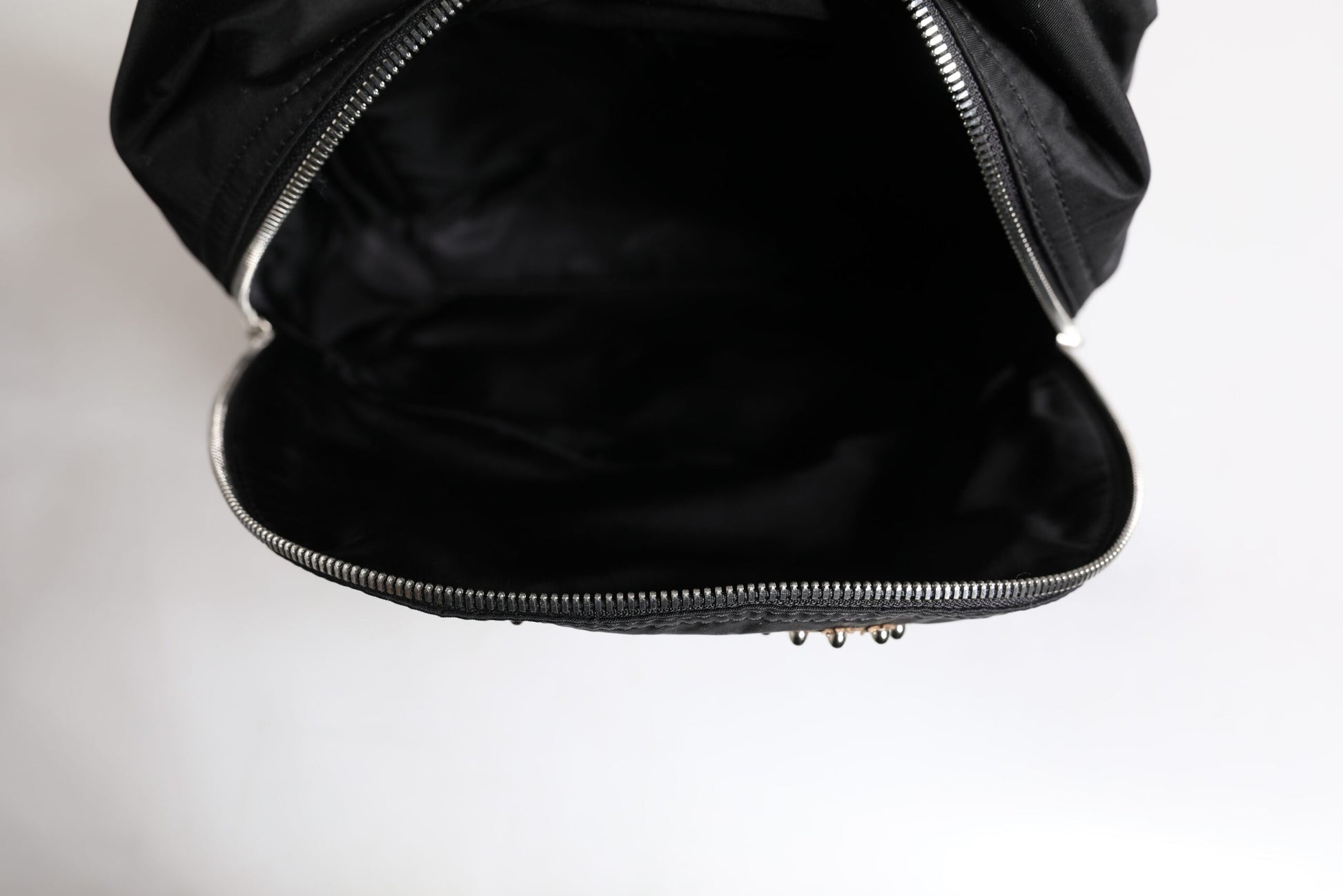 Backpack by Dolce & Gabbana for men in nylon black & signature presents a stately Vulcano Nylon Backpack design, showcasing a secure zipper with ample and versatile shoulder-strap & backpack-strap for a stately finish.