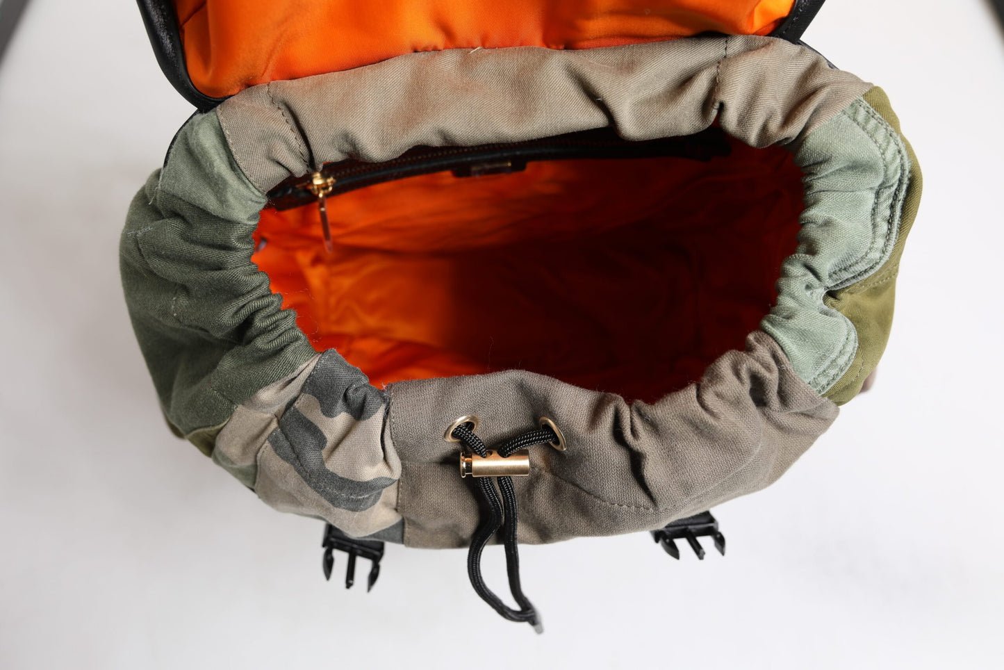 Large Drawstring Backpack by Dolce & Gabbana for men in calf leather & cotton military-green, camouflage, signature & patchwork showcases a stately Calf Leather Cotton Large Drawstring Backpack design, featuring a secure drawstring with stately internal-pockets and versatile backpack-strap.