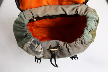 Large Drawstring Backpack by Dolce & Gabbana for men in calf leather & cotton military-green, camouflage, signature & patchwork showcases a stately Calf Leather Cotton Large Drawstring Backpack design, featuring a secure drawstring with stately internal-pockets and versatile backpack-strap.