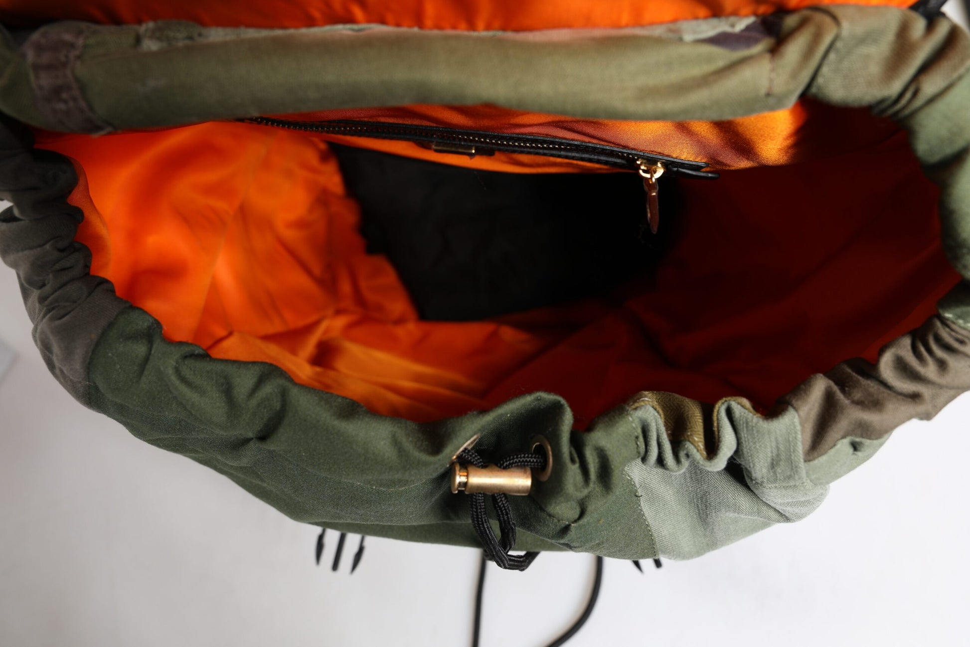 Large Travel Drawstring Backpack by Dolce & Gabbana for men in cotton & leather military-green, camouflage & patchwork showcases an architectural Cotton Leather Large Travel Drawstring Backpack design, featuring a secure drawstring, ample internal-pockets, and architectural backpack-strap for a sophisticated look.